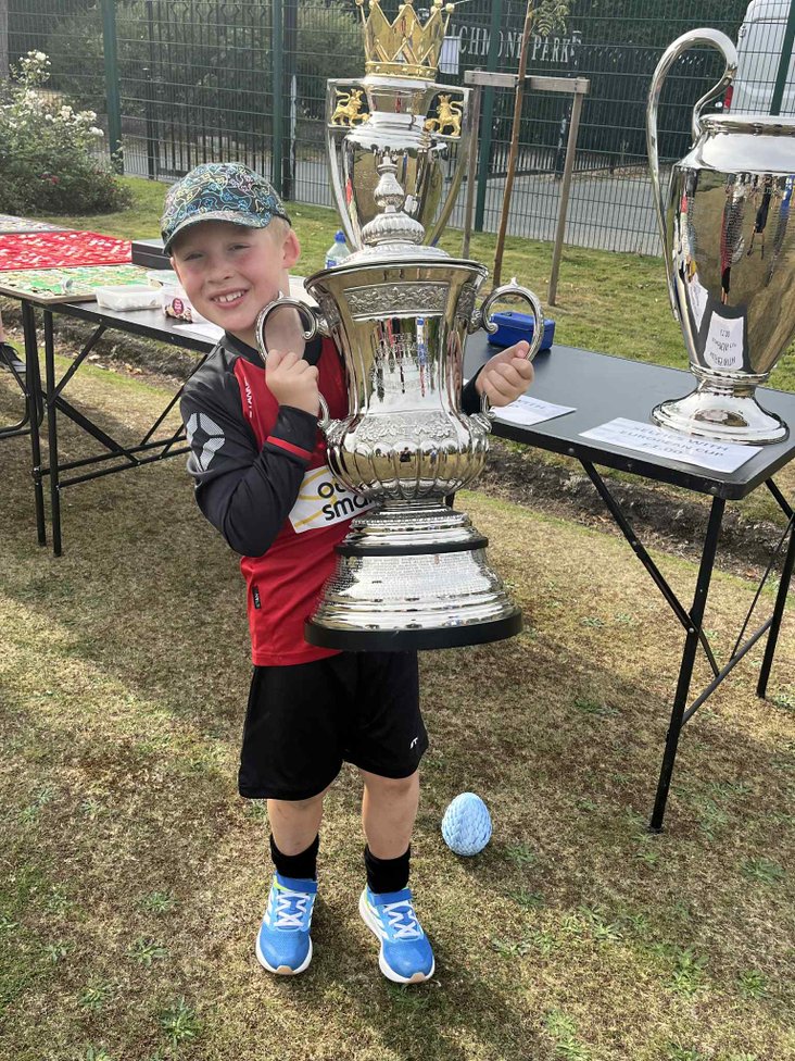 A  young fan with a replica of the FA Cup